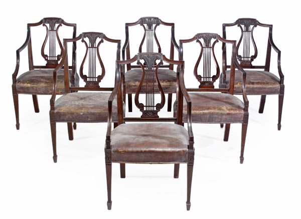 A set of six mahogany elbow chairs, in George III style, late 19th/early 20th century, each