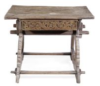 A Continental walnut trestle table, 18th century and later, with a frieze drawer, on trestle