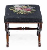 A William IV rosewood X-frame stool, circa 1835, with a needlework seat, the end supports united