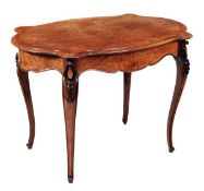 A Victorian amboyna and hardwood centre table, circa 1870, the quarter veneered serpentine top