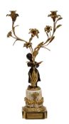 A French gilt and patinated bronze and white marble mounted twin light figural candelabrum, circa