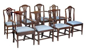 A matched set of eight mahogany dining chairs, including four armchairs and four side chairs, with v