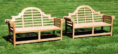 A pair of teak garden seats in the manner of Lutyens, of recent manufacture, the arched and
