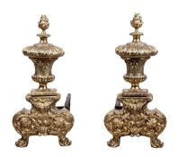 A pair of polished brass and wrought iron mounted fire dogs in Louis XIV taste, late 19th century, e