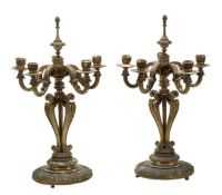 A pair of French gilt bronze five light candelabra, early 20th century, the foliate cast sockets