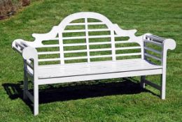 A painted teak garden seat in the manner of Lutyens, late 20th century, the arched and serpentine