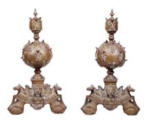 A pair of brass and wrought iron mounted fire dogs in Louis XIV style, circa 1900, each with an