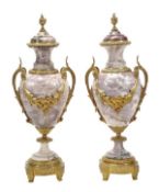 A pair of gilt metal mounted mauve and variegated white marble twin handled urns, early 20th