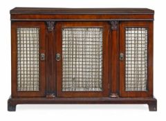 A Regency mahogany side cabinet, circa 1815, the rectangular top with reeded edge, above three