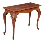 A Victorian oak hall table, circa 1880, the rectangular top with moulded edge above a shaped