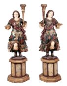 A pair of carved wood and painted figural torcheres in Continental 18th century style, 20th