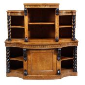 A William IV pollard oak and ebonised breakfront bookcase, circa 1835, the upper section with open s