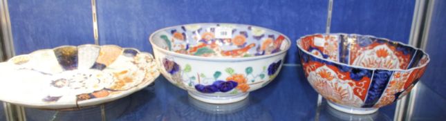 Two Imari palette bowls and a scalloped rimmed charger; 31cm in diameter