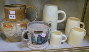 A graduated set of measuring jugs, a stoneware harvest jug, two Gaudy Welsh jugs and loving cup