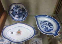 A Chinese Export porcelain spoon tray with central armorial; 18cm wide, together with another blue