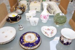 A Meissen cup and saucer of cobalt blue ground with gilding and panels decorated with Watteuesque