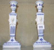 A pair of Royal Copenhagen columnar candlesticks (one with loose sconce), inscribed 1/15 to base;