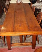 A 19th Century style cherrywood farmhouse table with three plank top and cleated ends on square