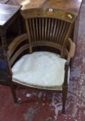 An Edwardian Sheraton revival rosewood armchair