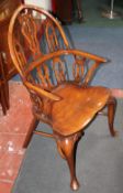 A set of ten Gothic style windsor chairs to include two armchairs each with arcaded pierced splat