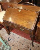 An 18th Century style mahogany bureau with a fitted interior, frieze drawer on cabriole legs and