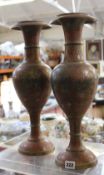 A pair of Indian brass baluster vases with peacock decoration; 45cm high Best Bid