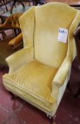 A Georgian style upholstered wing armchair  Best Bid