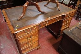 A Georgian style yew wood twin pedestal partners desk with inset leather top 76cm, high, 153cm wide