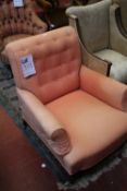 A Victorian upholstered button back armchair