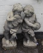 A pair of reconstituted stone garden figures, 20th century