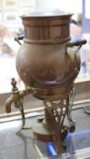 A Victorian copper tea kettle and stand, a copper water heater and a brass inkwell etc. Best Bid