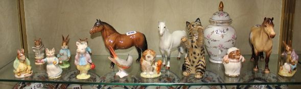 A Beswick model of a cat (1883), a Beswick model of a `Highland` horse two further Beswick horses,