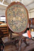 A Victorian mahogany firescreen, inset with floral needlework panel 113cm high, 56cm wide  Best Bid
