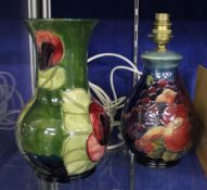 A Moorcroft table lamp decorated with birds on fruit; 20cm high, (sold as parts), together with