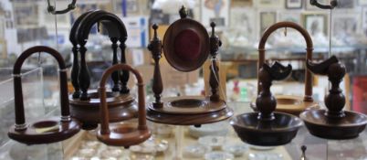 A collection of Victorian and later treen watch holders