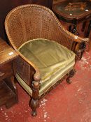 A reproduction bergere Burgomaster chair