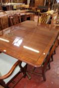 A Georgian style mahogany and crossbanded twin pedestal dining table 173cm length and set of six