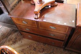 An Edwardian mahogany chest with two short and two long drawers 107cm wide