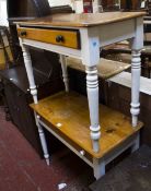 Two painted pine side tables each with a frieze drawer on turned legs