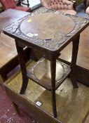 A Chinese carved two tier table and a reproduction coffee table