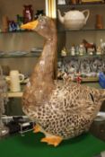 A large French ceramic model of a goose, approximately 71cm high together with a smaller