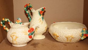 A Clarice Cliff `Celtic Harvest` Teapot and cover, salad bowl and jug (3)