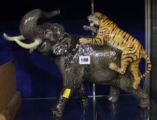 A Beswick model of an elephant with an attacking tiger; approximately 30 cm high (tusk reglued)