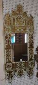 A Moorish mirror with gilt stylised decoration 122cm high, 52cm wide