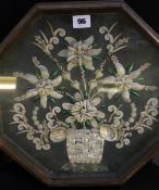 A Victorian shell work composition held in a glazed octagonal frame; approximately 36 x 36cm