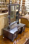 A 19th century rosewood swing toilet mirror