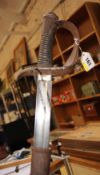 A cavalry sword with curved blade, impressed S&K to blade base