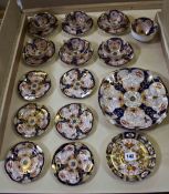 A Royal Crown Derby 4971 pattern part tea set comprising six cups, saucers, small plates, one sugar