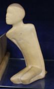 A carved hardstone model of a kneeling figure; 29cm high Best Bid