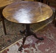 A George III circular tilt top tripod table 74cm high, 90cm diameter